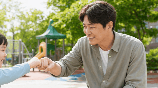Dad and child playing in sunny park