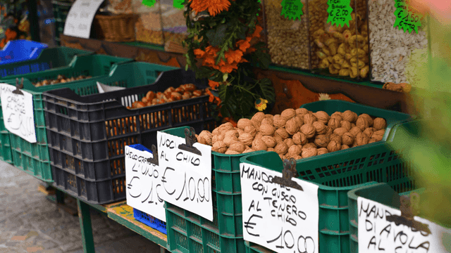 Market stall with various nuts and prices