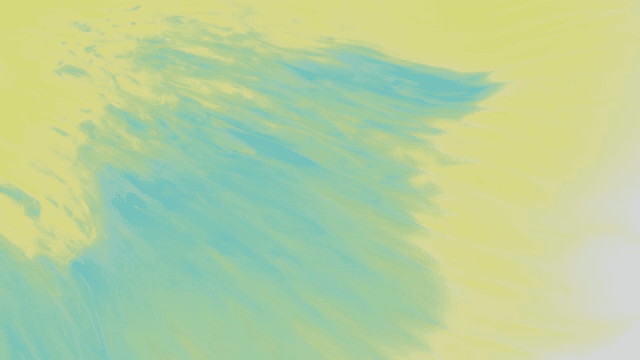 Abstract pattern of yellow and green liquids mixing together