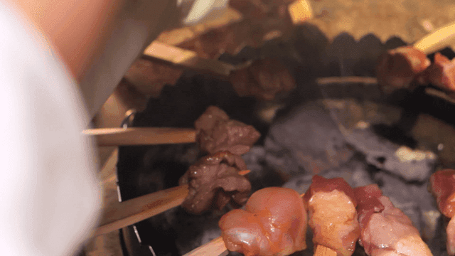 Primitive skewers grilling over brazier