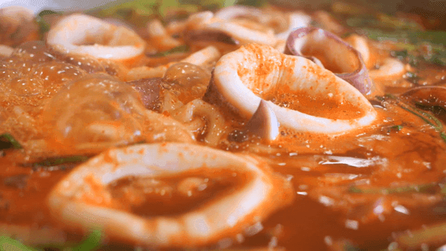 Spicy squid kalguksu boiling in pot