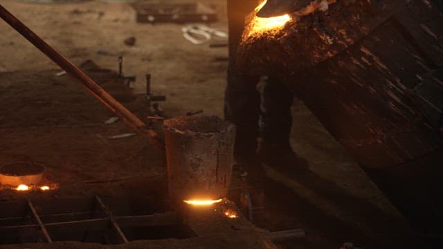 Molten metal being poured into a mold