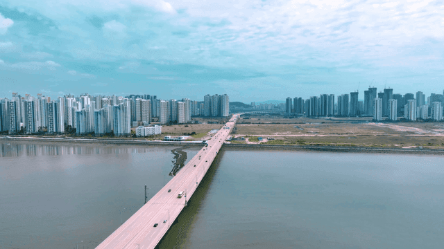 Bridge leading to modern city skyline