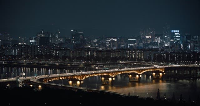 Illuminated City Bridge at Nighttime