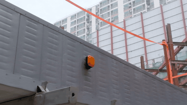 Construction site with building in background