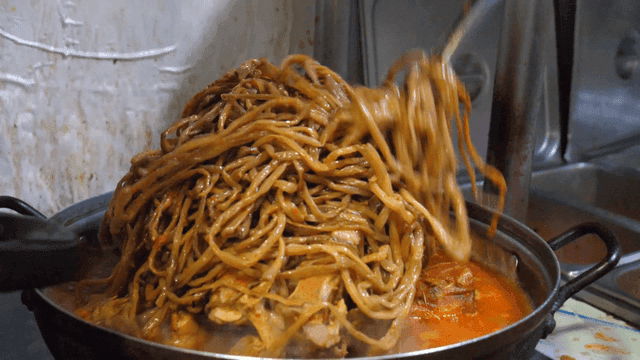 Pork backbone stew with sweet potato stems on top