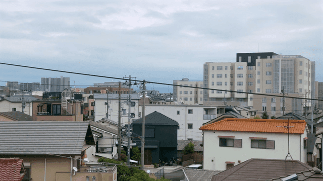 Quiet suburban residential area under cloudy sky