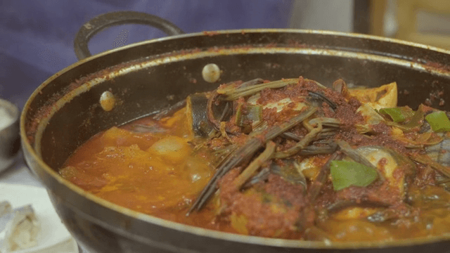 Korean braised mackerel boiling in a pot