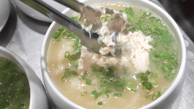 Chicken kalguksu topped with plenty of chicken