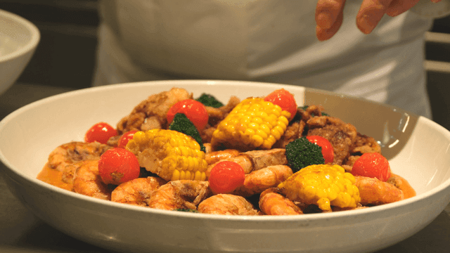 Chef preparing a seafood dish
