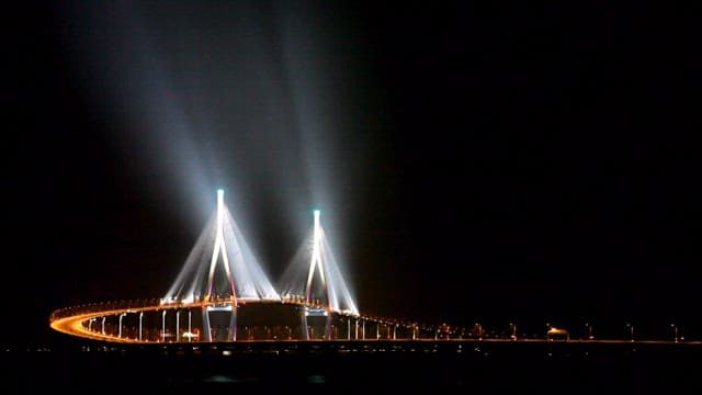 Incheon Bridge with lights on the water at night