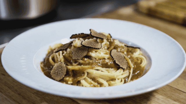 Pasta with truffle slices on a plate