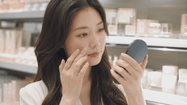 Woman checking cosmetics in store