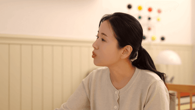 Middle-aged woman talking in room