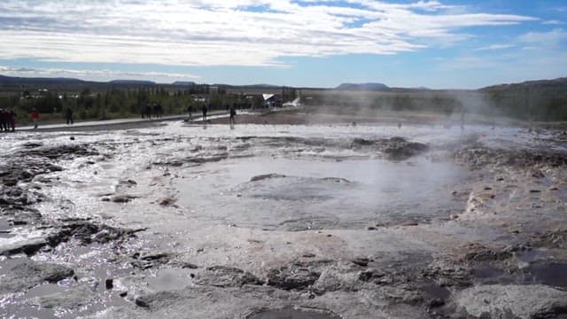 Geyser Eruption in Geothermal Field on a Sunny Day
