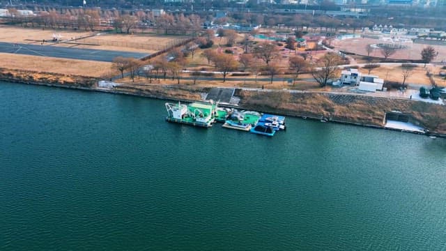 Cityscape with Rescue Boats and Riverside Park