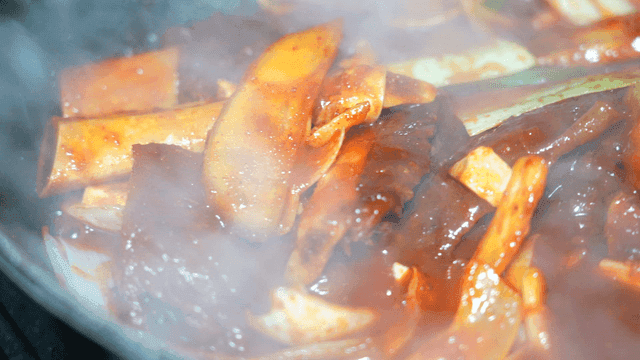 Spicy braised short ribs boiling in pot
