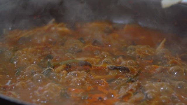 Simmering Hotpot with Steam and Added Noodles