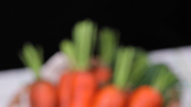 Fresh carrots in a woven basket