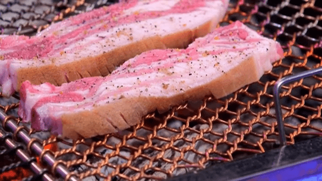 Placing Seasoned Pork on the Grill