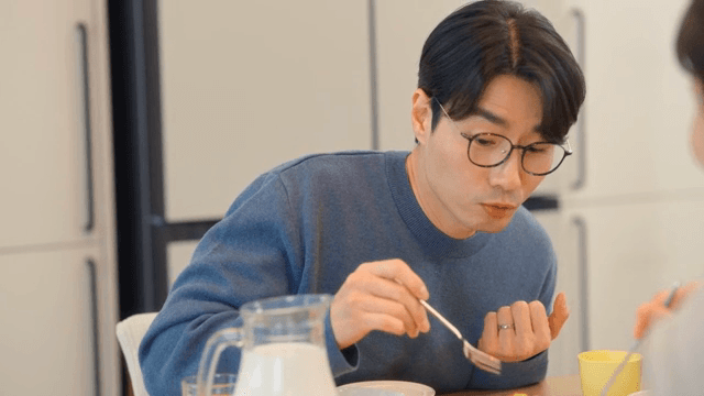 Man enjoying a meal at a dining table
