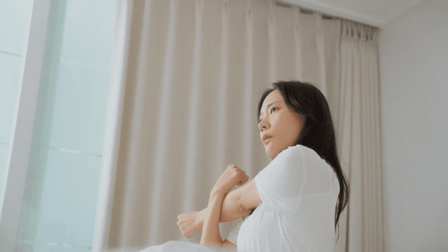Woman Stretching and Relieving Stress Indoors