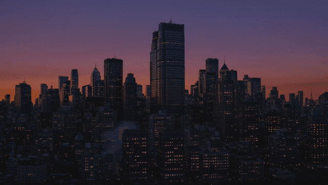 City skyline at sunset transitioning to night