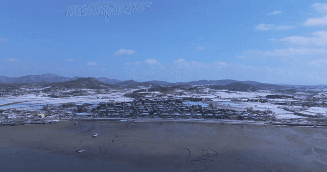 Snow-covered Hanok village and plains