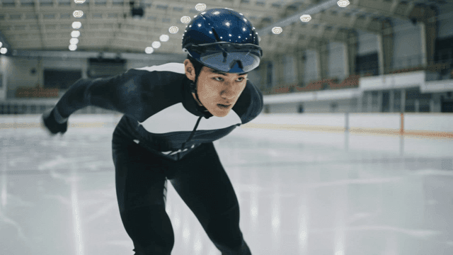 Speed skater practicing on ice rink
