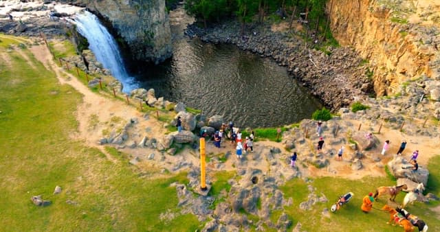 Scenic waterfall with surrounding greenery