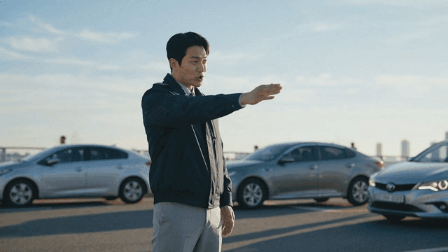 Police officer directing traffic on busy road