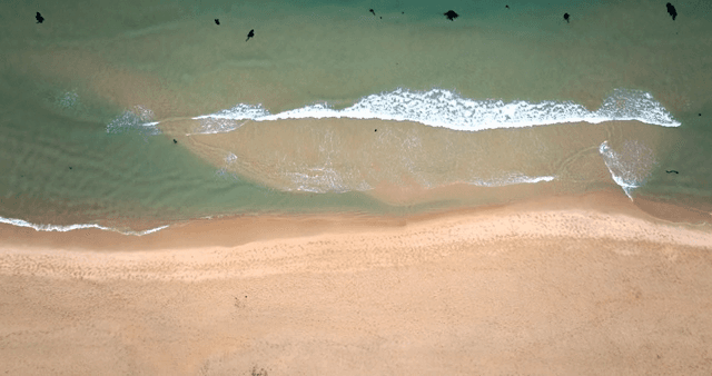 A serene beach with gentle waves