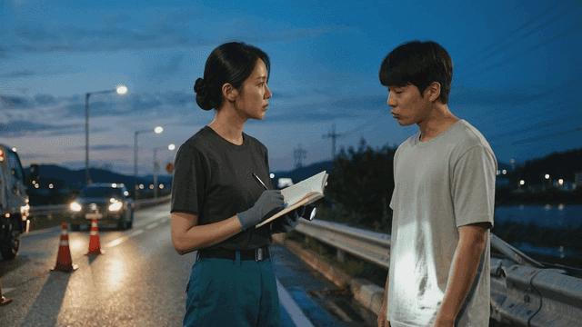 Woman investigating on night road