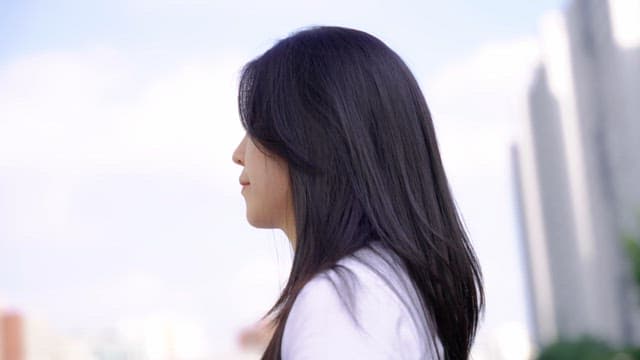 Woman smiling outdoors in the city