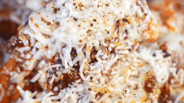 Spicy braised short ribs with melted cheese