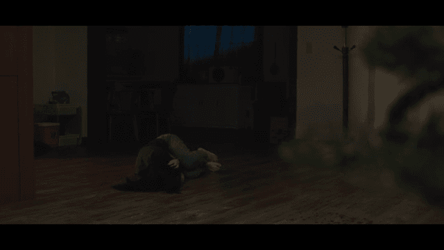 Woman lying down after being assaulted