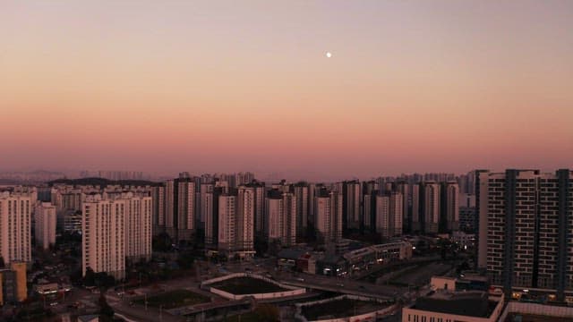 Cityscape with Apartments in the Evening Sunset