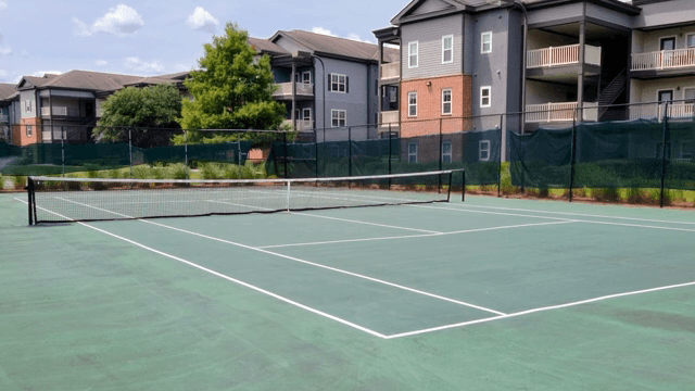 Empty tennis court in a residential area
