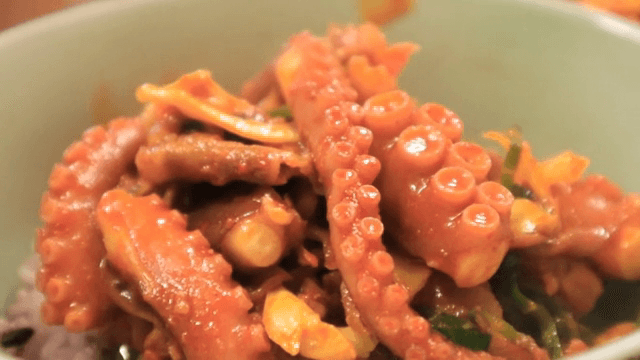 Spicy stir-fried octopus in a bowl