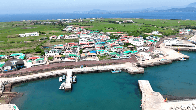 Coastal village pier with colorful roofs