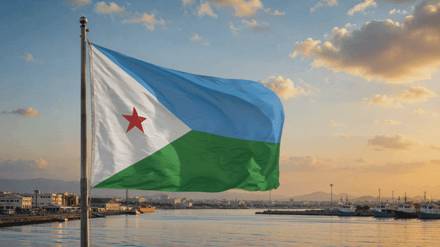 Djibouti flag fluttering by water at sunset