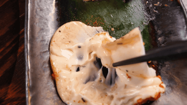 Grilled squid pieces dipped in mayonnaise