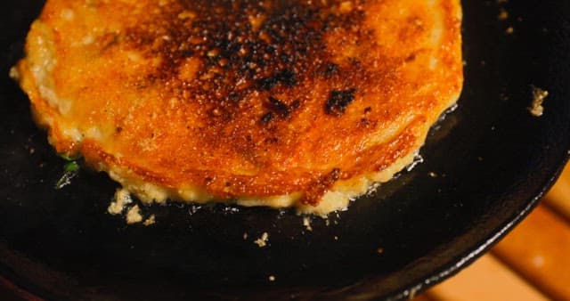 Preparing Savory Korean pancake on a Hot Skillet