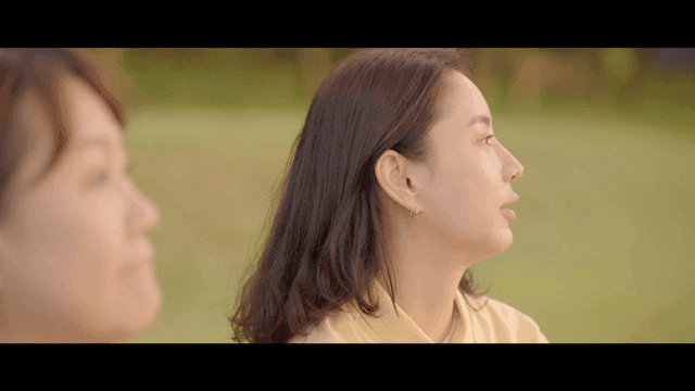 Two women having peaceful conversation outdoors