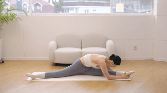 Woman practicing yoga indoors