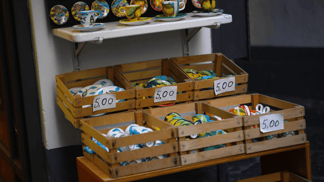 Display of ceramic cups and plates in various colors
