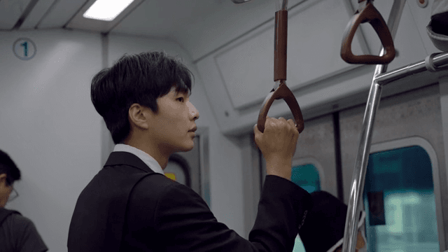 Office worker male riding the subway