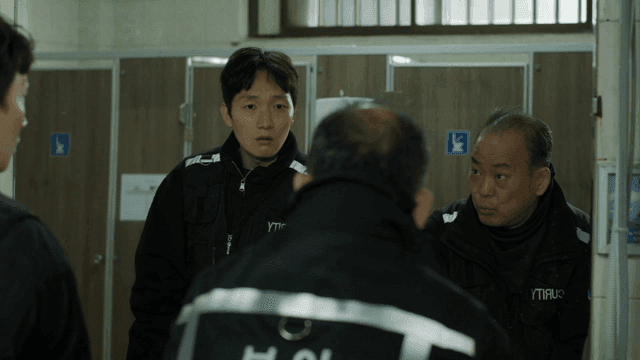 Security guards talking while washing their hands in restroom