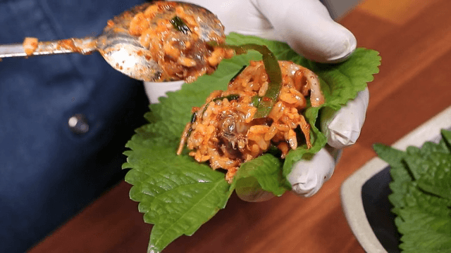 Putting Cockel Bibimbap on Perilla Leaves