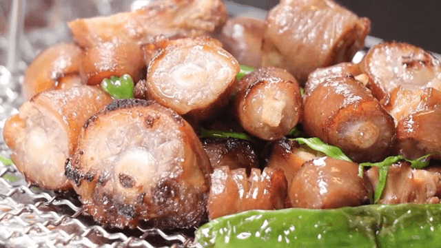 Pork tail stew on wire mesh
